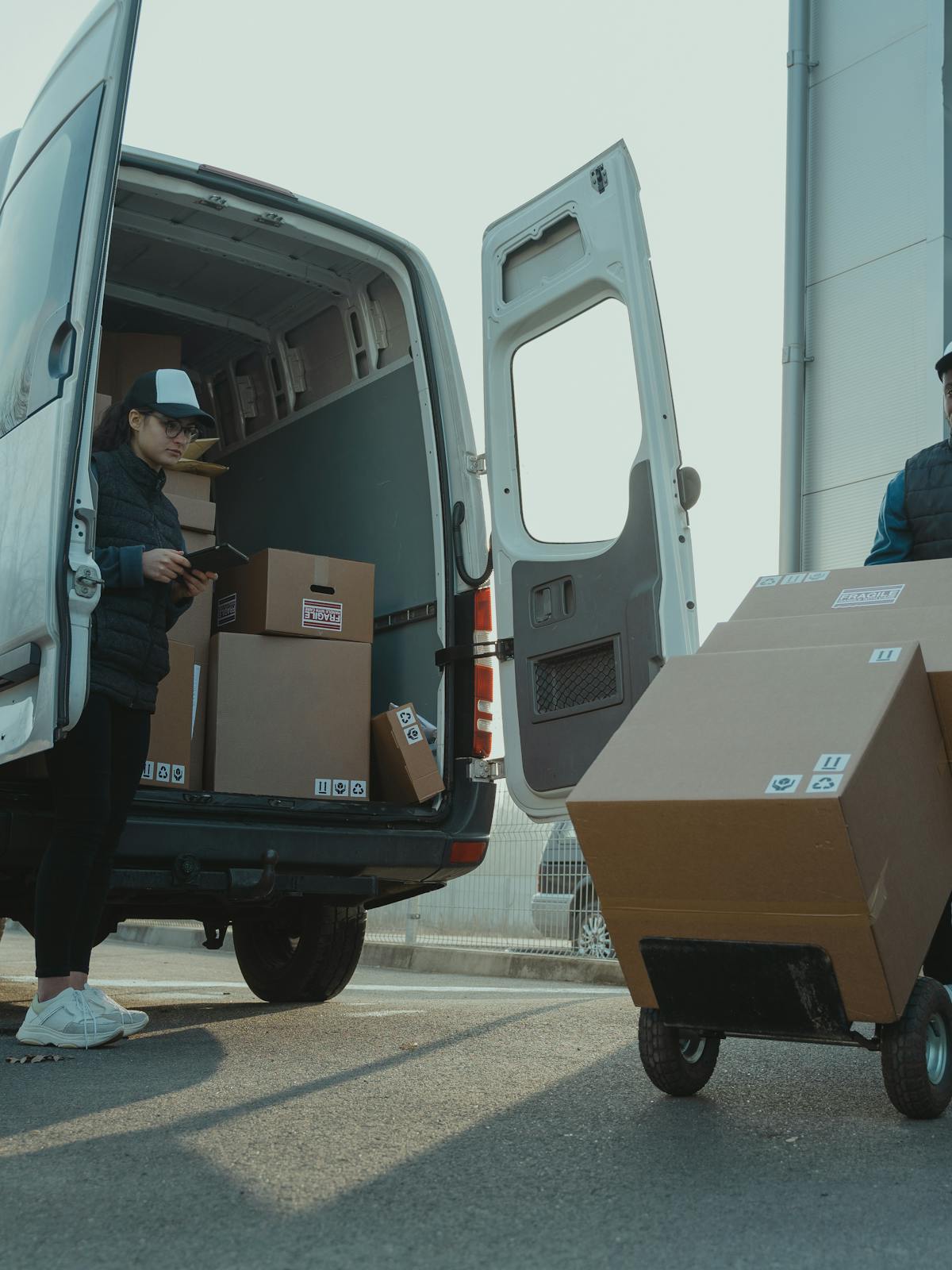 Delivery team handling boxes for medical distribution logistics